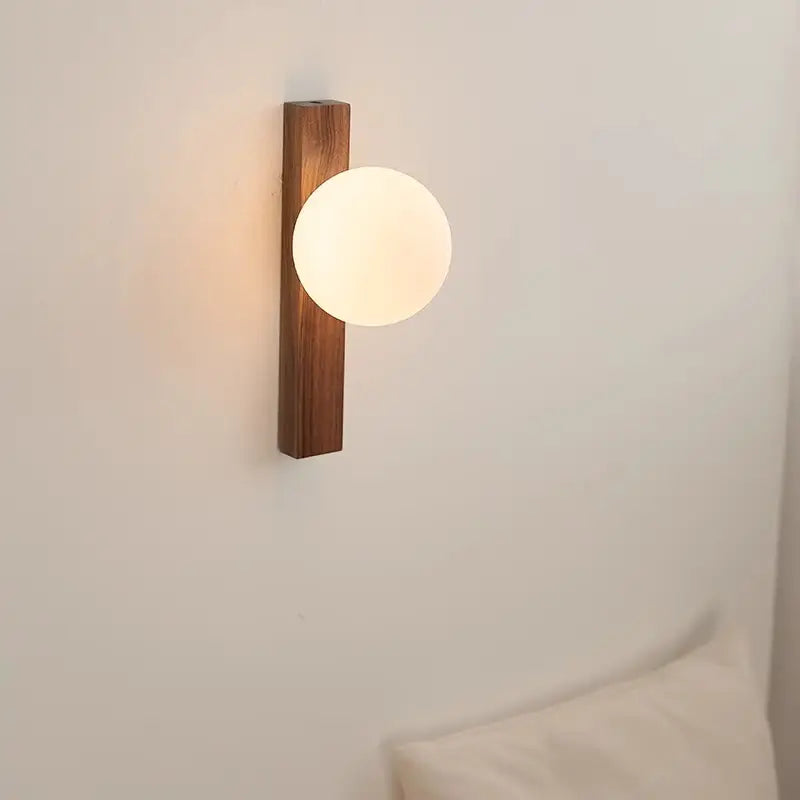 Wood wall sconce warm light glass globe